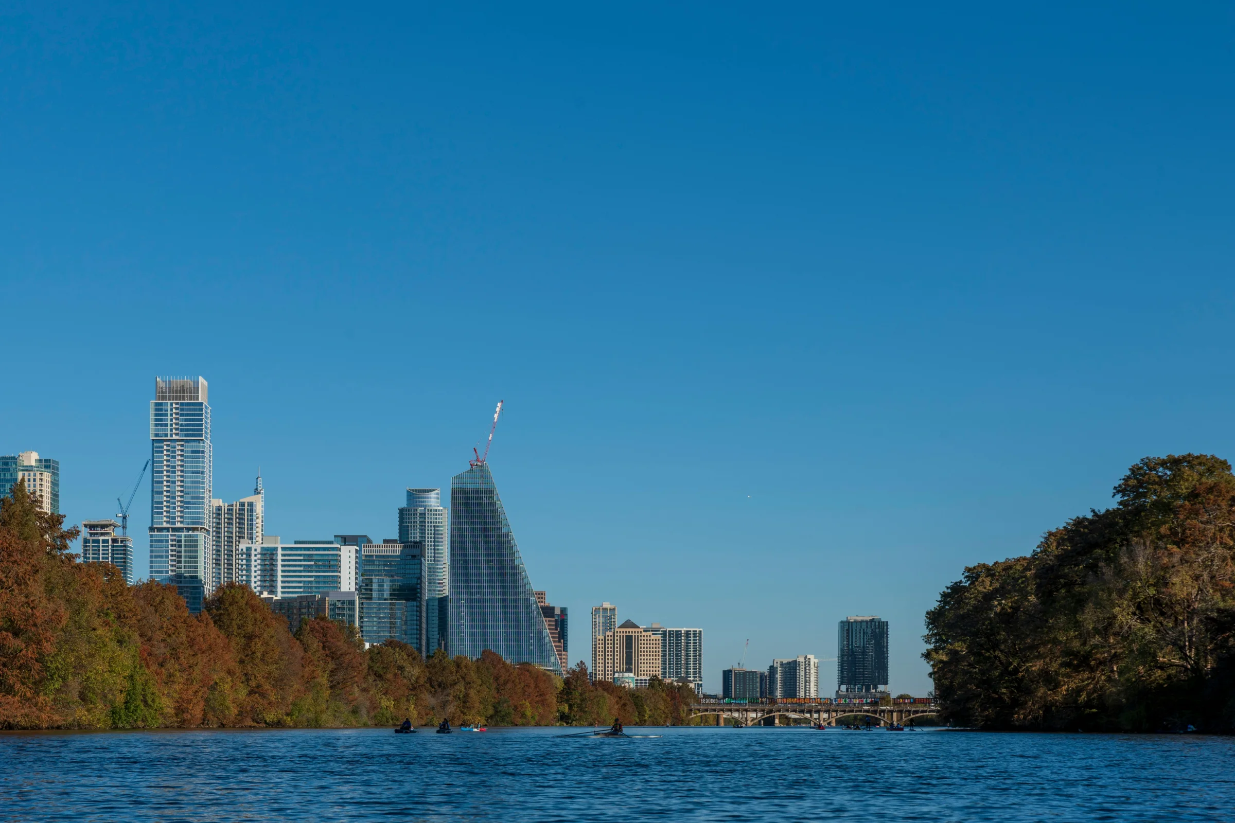 Austin, Texas skyline glowing at sunset across Lady Bird Lake