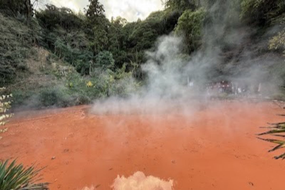 Chinoike Jigoku red-orange Blood Pond Hell steaming in Shibaseki district of Beppu