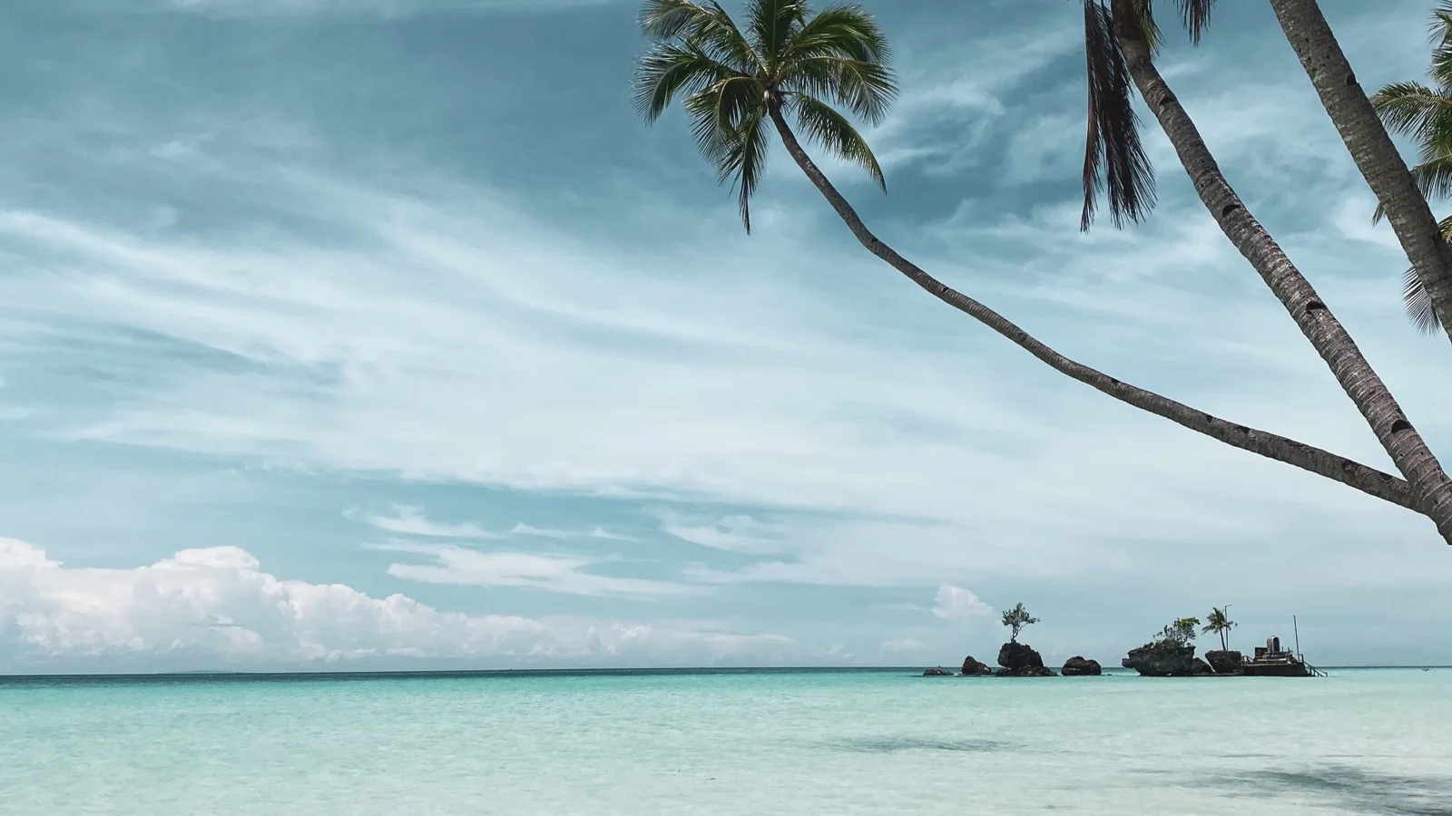 Willy's Rock grotto and calm turquoise water along White Beach Station 1 in Boracay