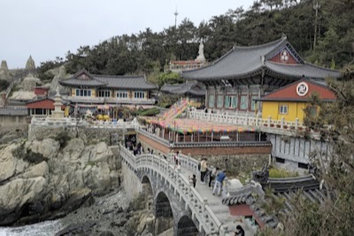 Haedong Yonggungsa Temple seaside pagodas on coastal cliffs with crashing waves below