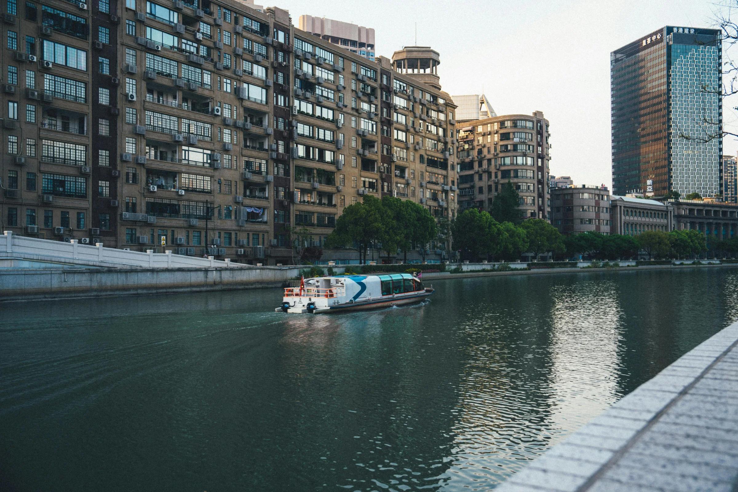 Dusk view of Chengdu city skyline and lively modern street in Sichuan, China.
