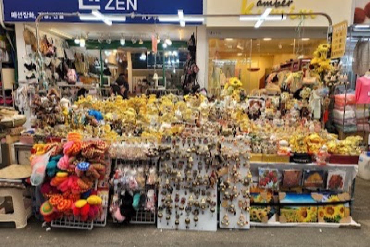 Seomun Market crowded street food alleys with napjak mandu stalls and steam rising at night in Daegu