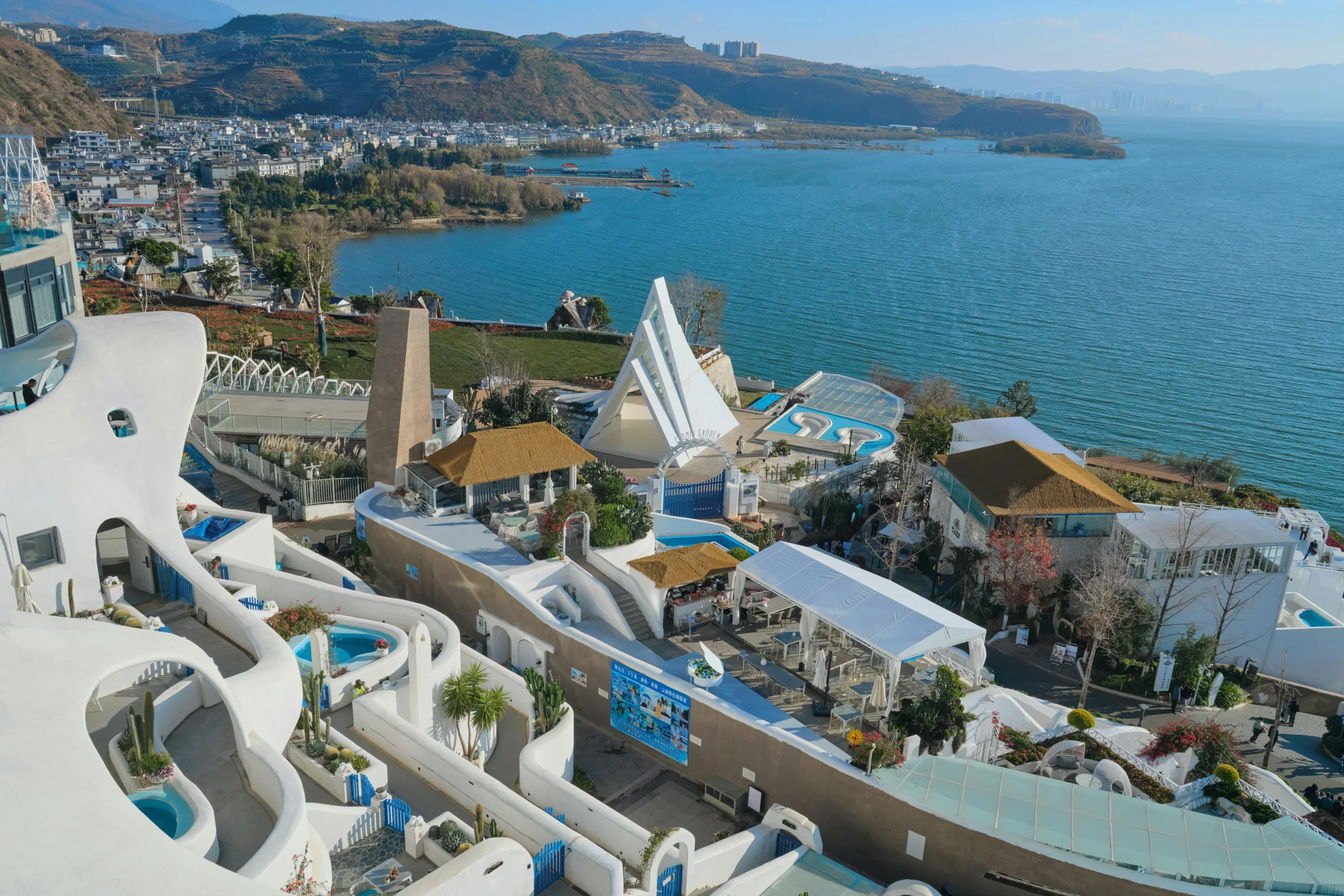 Sunset street scene in Dali Ancient Town with the Cangshan Mountains in the background, Yunnan, China.