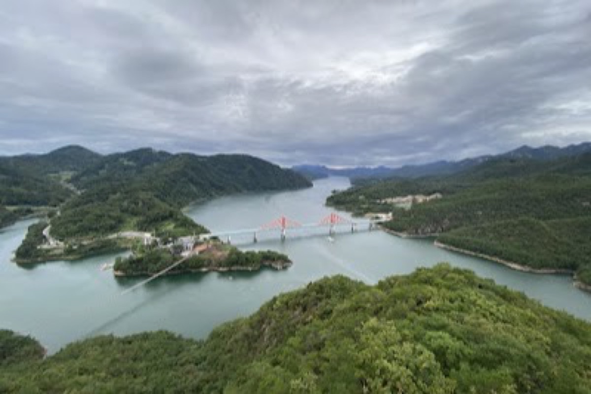 Oksunbong Peak needle-shaped cliff mirrored in the Namhangang River at sunset in Danyang