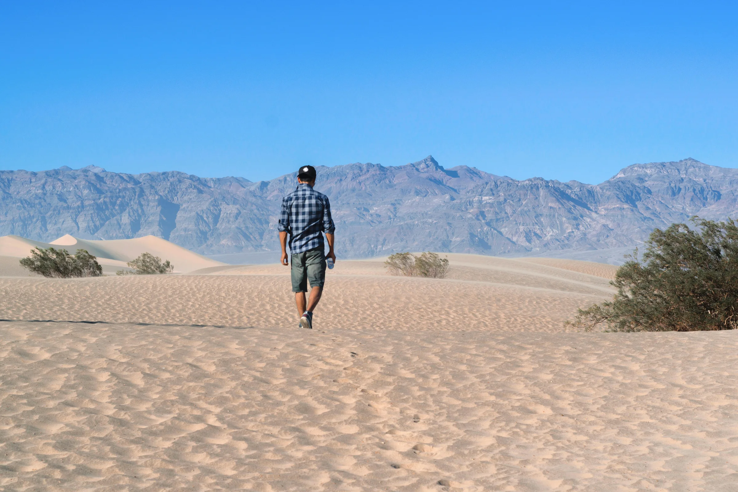 Sunrise over rolling sand dunes in Death Valley National Park, United States