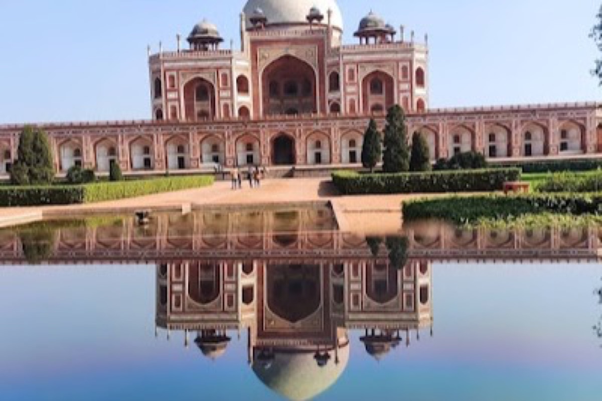 Humayun's Tomb rising above its symmetrical charbagh gardens in morning light