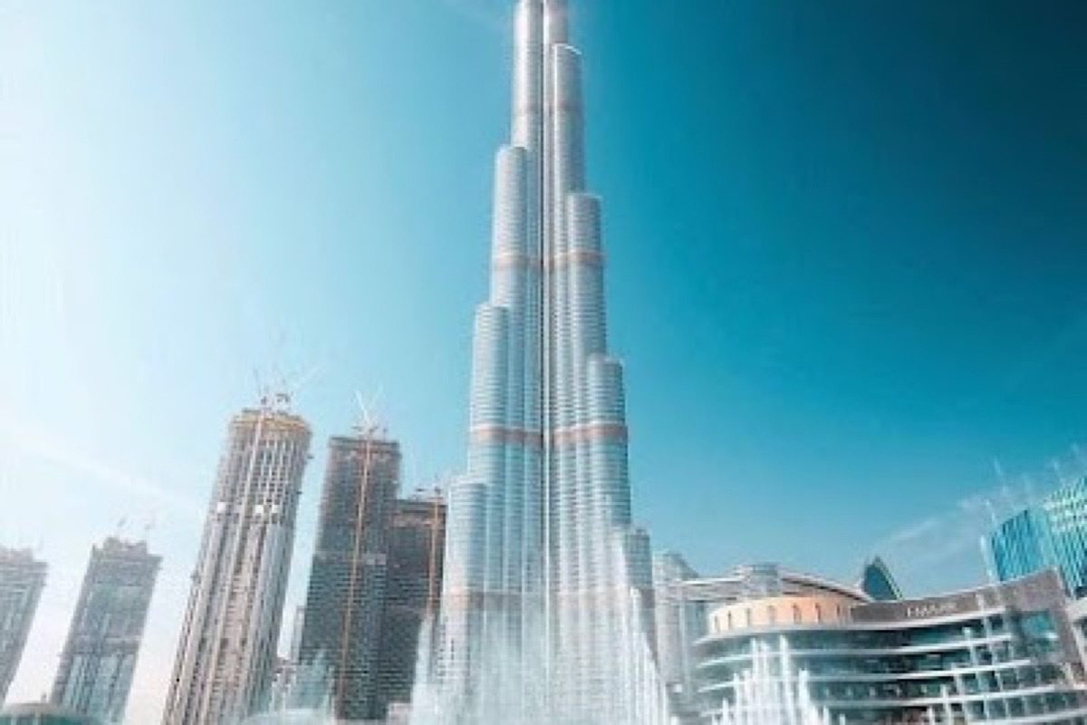 Burj Khalifa observation deck view over the Downtown Dubai skyline at sunset