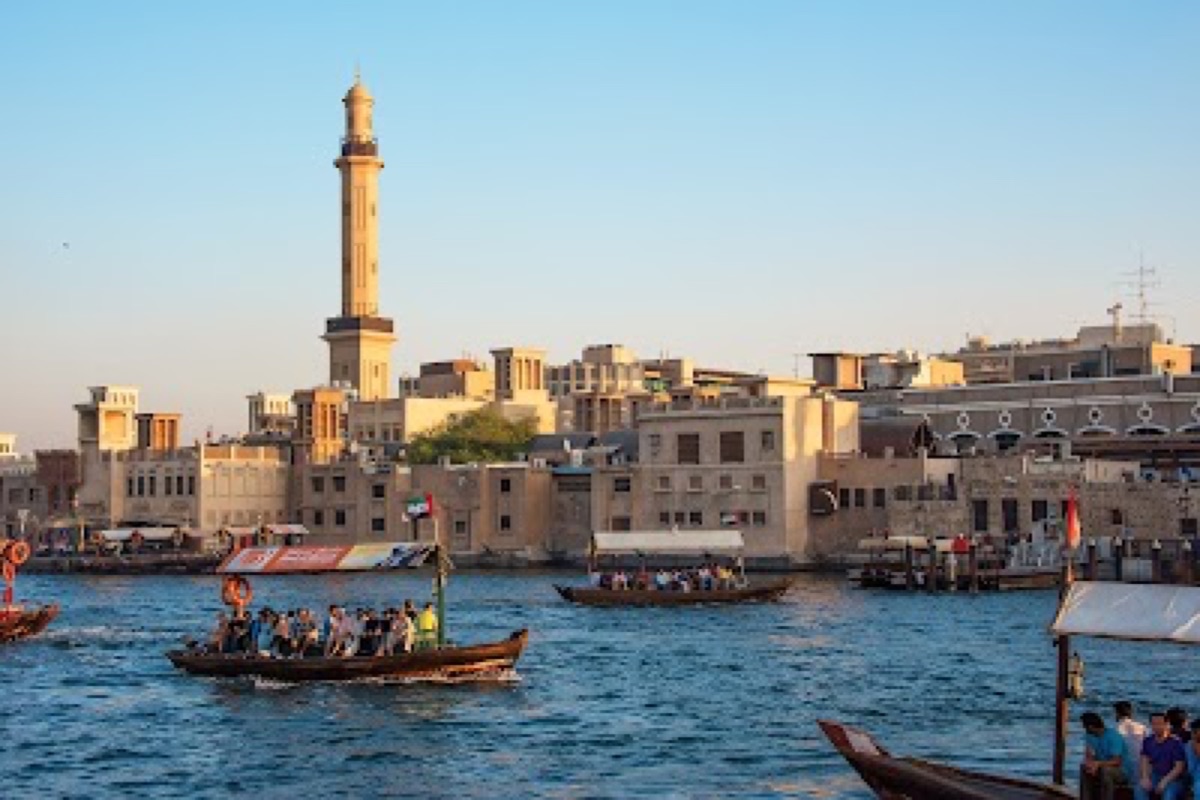 Traditional wooden abra crossing Dubai Creek between Bur Dubai and Deira