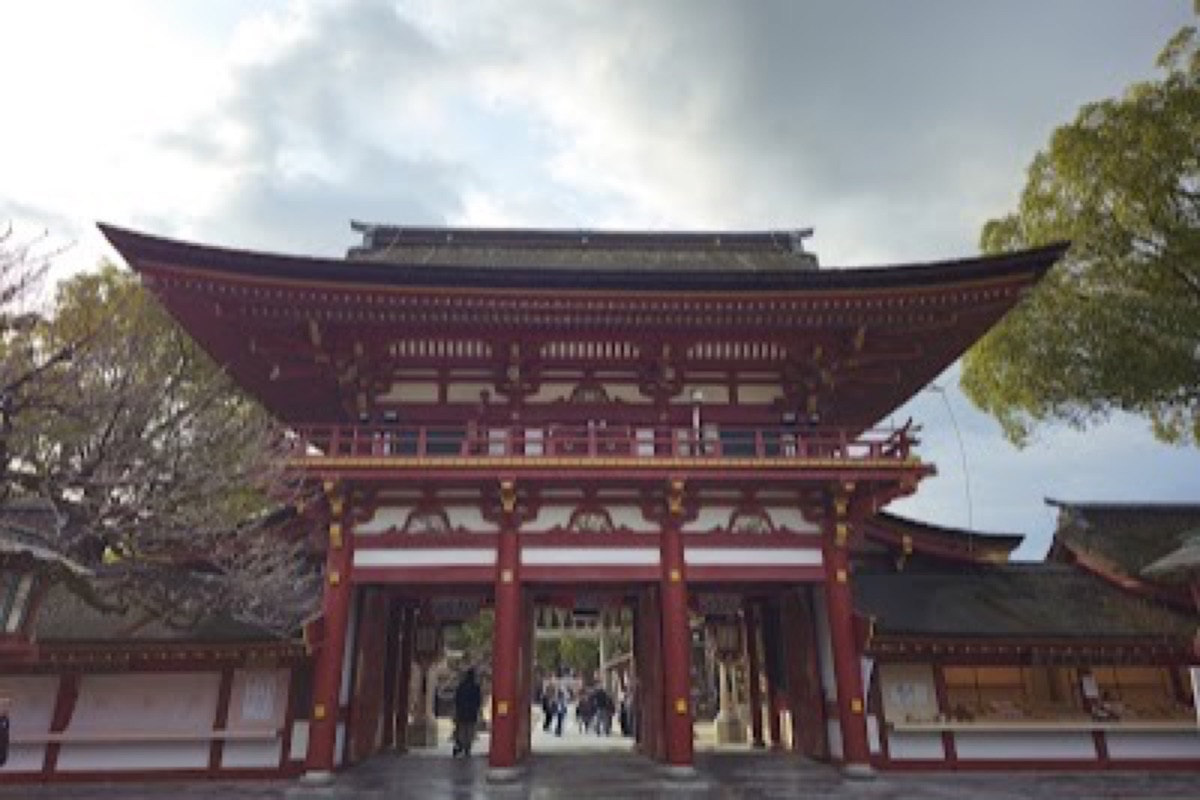 Dazaifu Tenmangu shrine approach with torii gate and stone lanterns