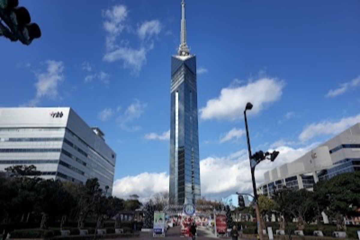 Fukuoka Tower standing against a sunset sky over Momochi seaside