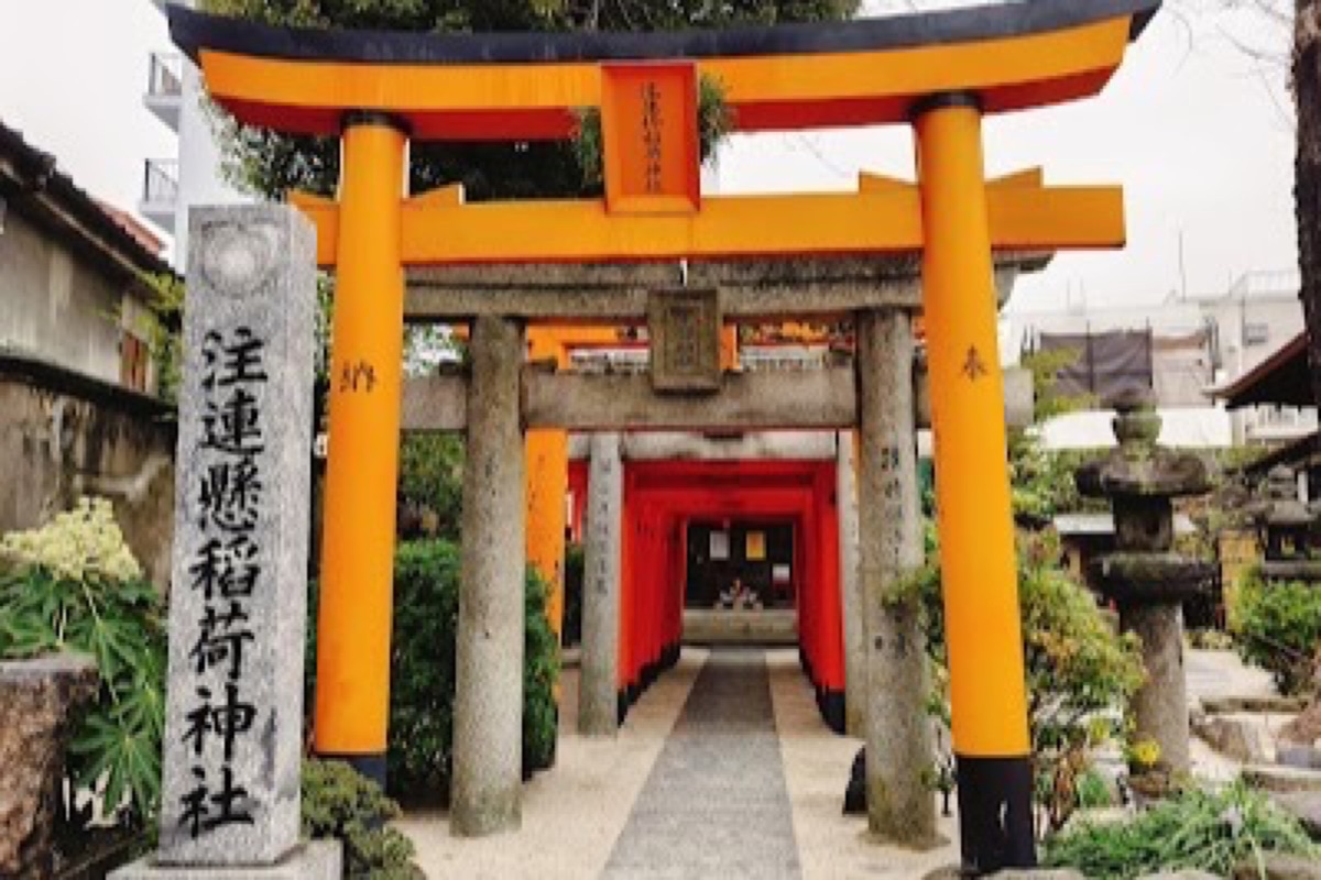 Kushida Shrine entrance with decorative floats visible in the grounds in Hakata