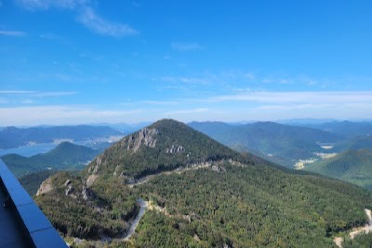Geoje Panorama Cable Car double-decker gondola above Nojasan Mountain with panoramic coastline and archipelago views
