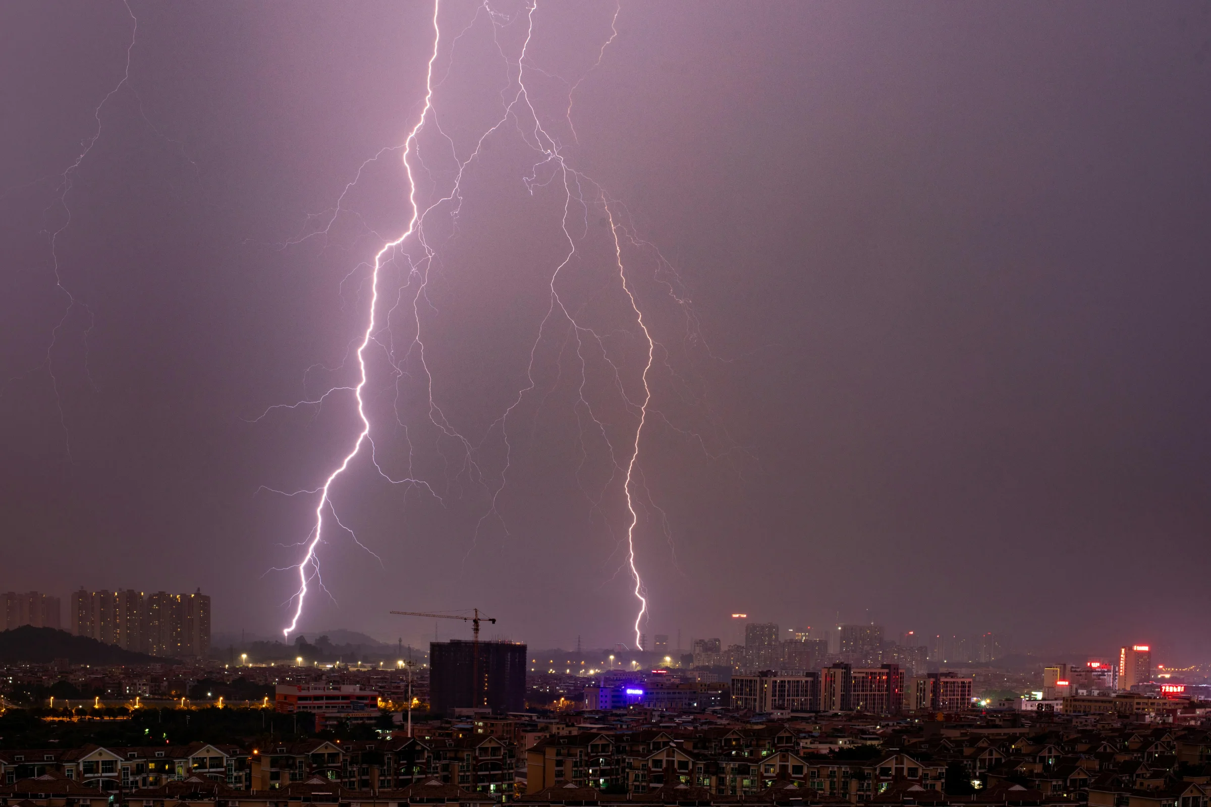 Night view of Guangzhou skyline featuring the Canton Tower and city lights
