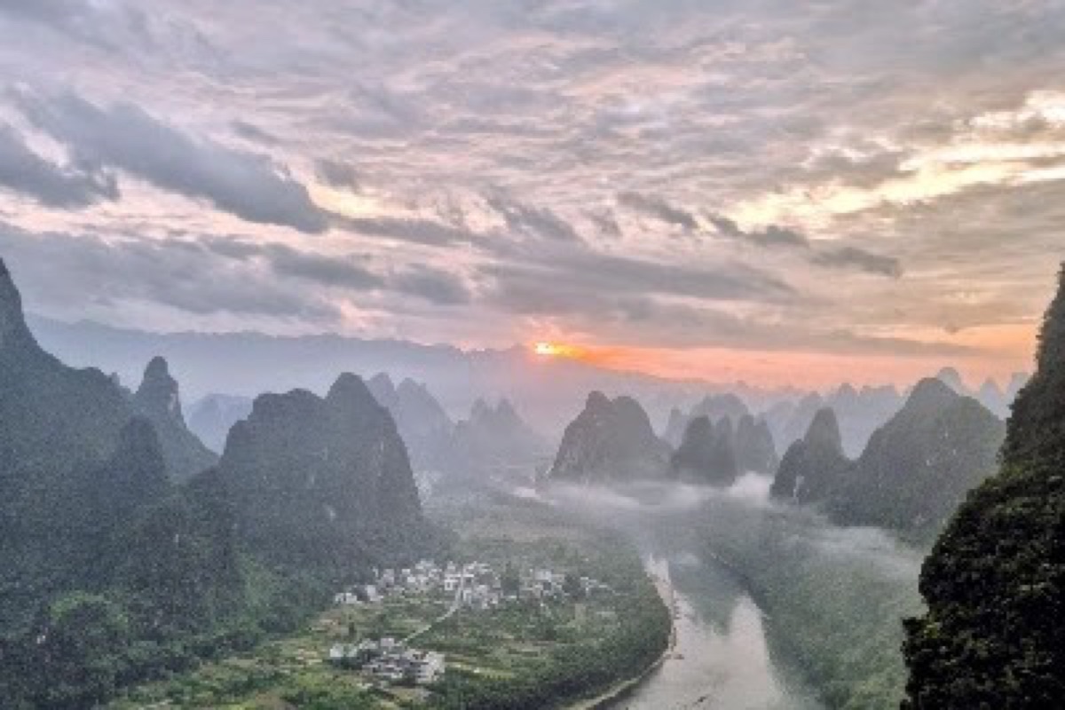 Xianggong Mountain sunrise viewpoint over the Li River bend in Yangshuo