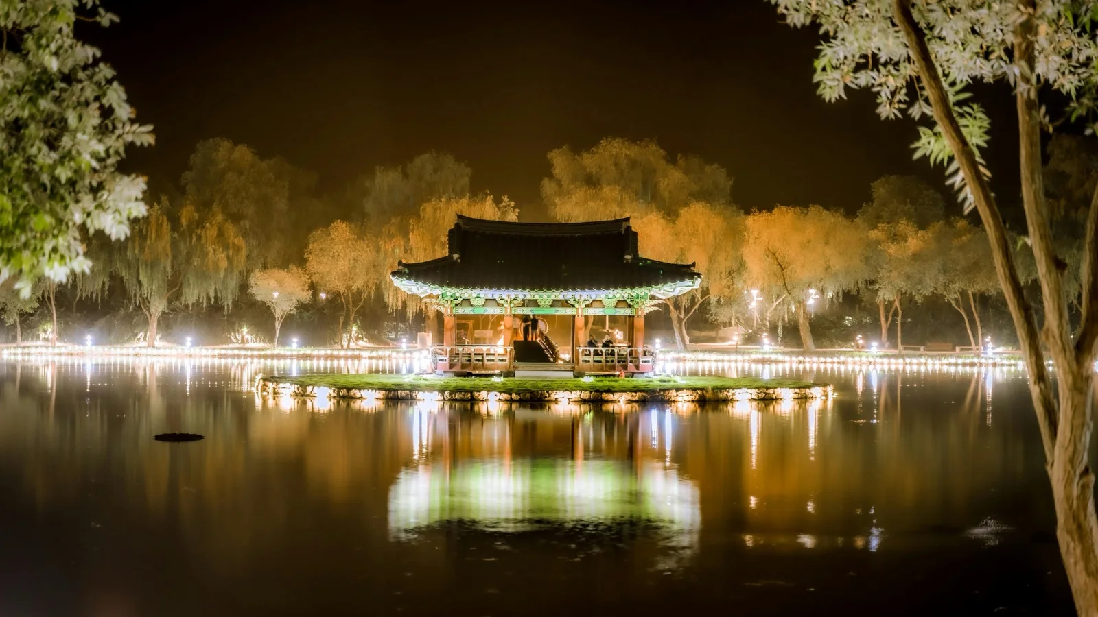 Bulguksa Temple stone terraces and twin pagodas with forested hills behind the main hall in Gyeongju