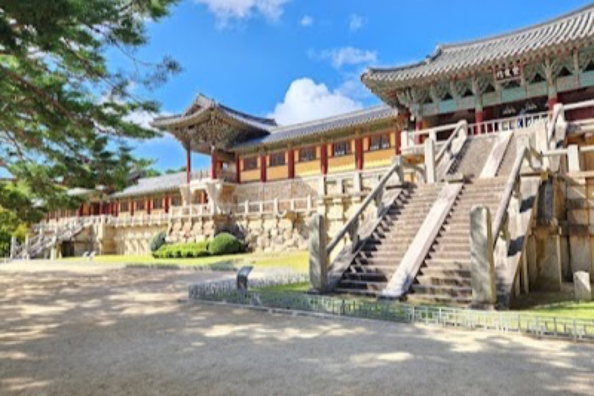 Bulguksa Temple stone terraces and twin pagodas with painted eaves against forested hills in Gyeongju