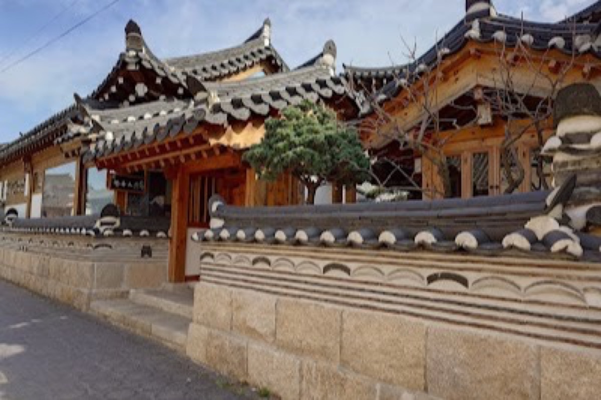 Hwangnidan-gil renovated hanok houses with cafes and bakeries along a tree-lined street in Gyeongju