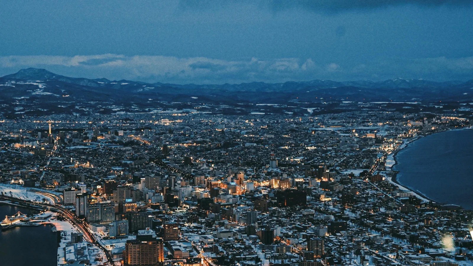 Hakodate night view from Mount Hakodate summit with city lights between two bays