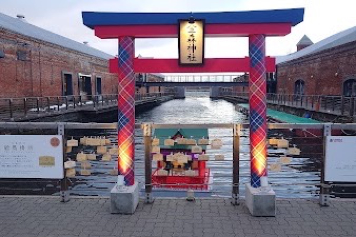 Kanemori Red Brick Warehouse facades glowing at night along Hakodate Bay waterfront