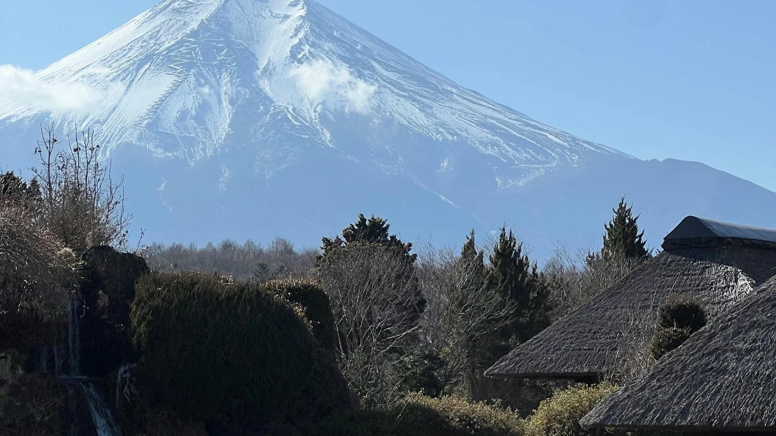 Heiwa no Torii gate rising from Lake Ashi with Mount Fuji in the background