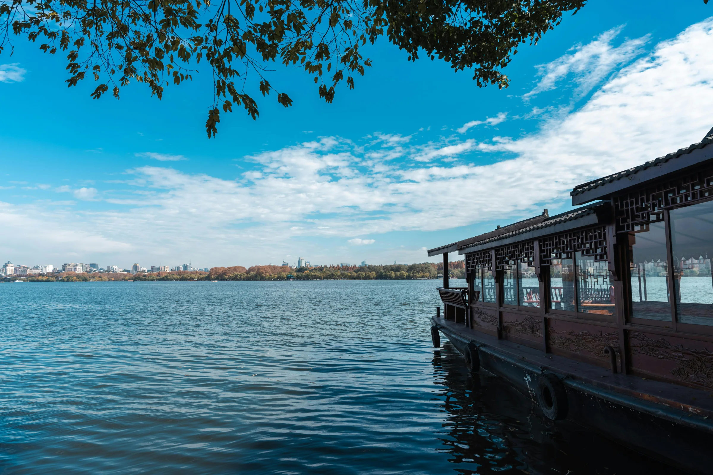 Panoramic sunset view of Hangzhou skyline across West Lake, China
