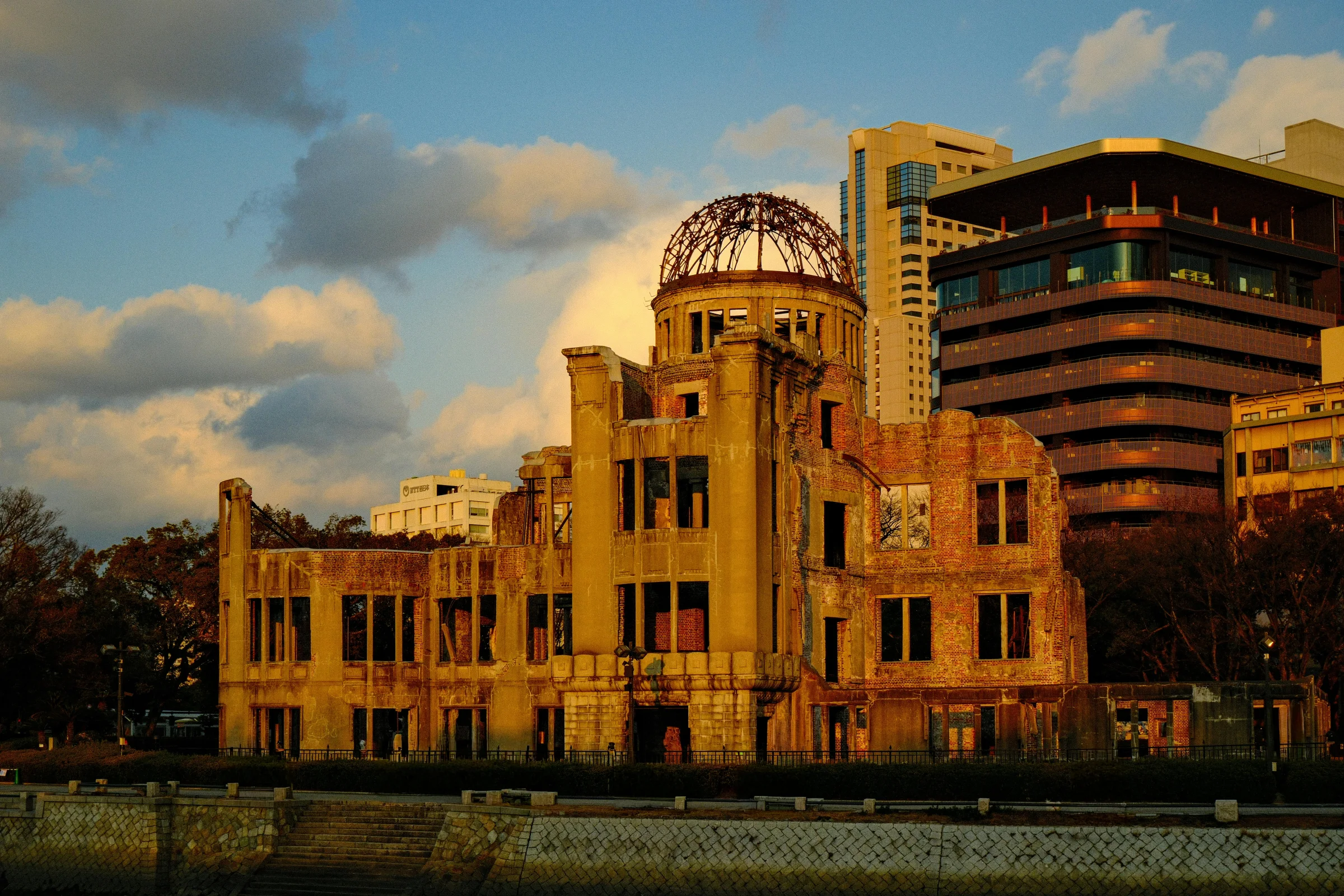 Hiroshima Peace Memorial (A-Bomb Dome) with city skyline at sunset