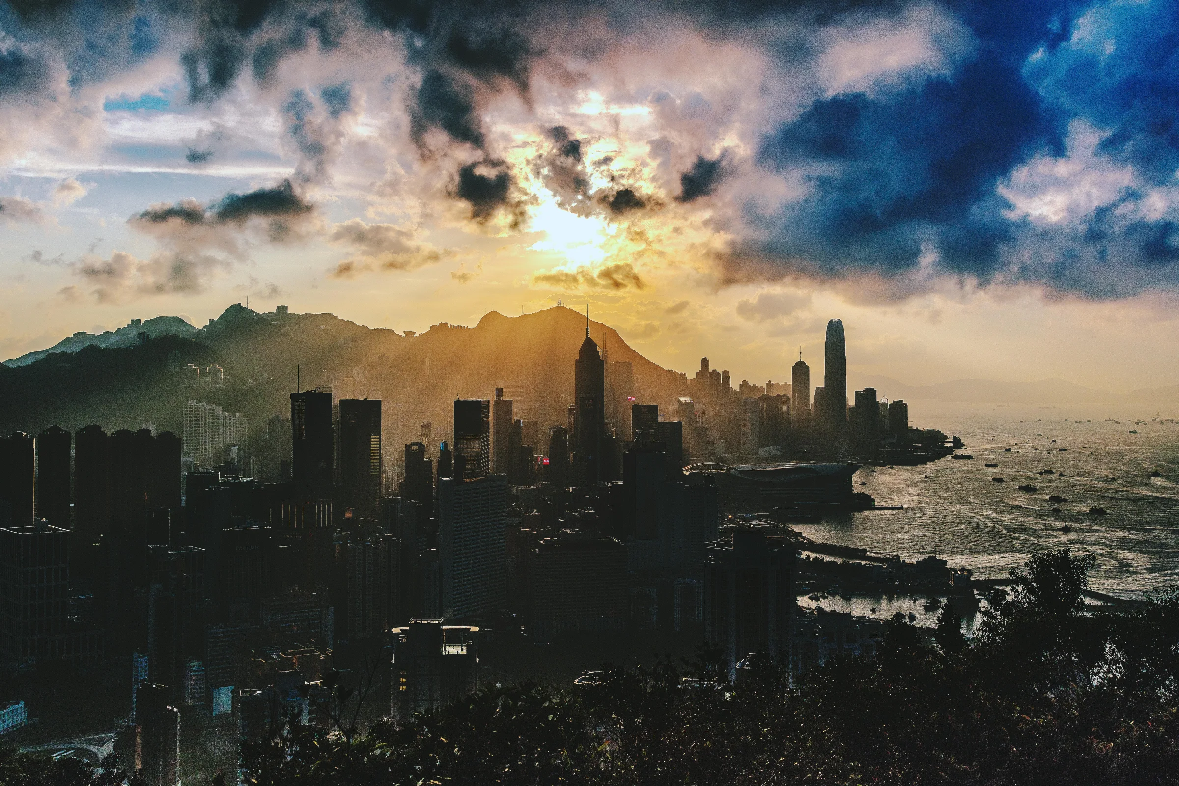 Night view of Hong Kong skyline across Victoria Harbour with city lights