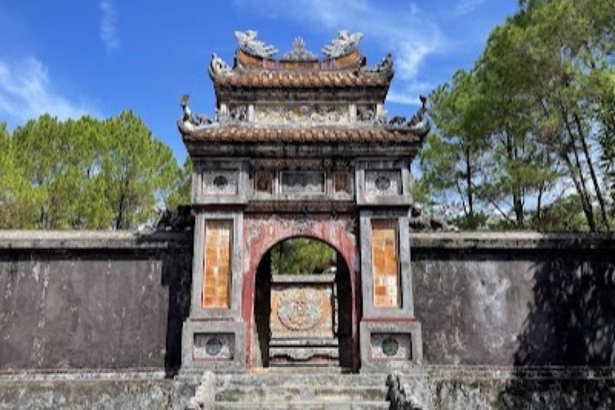Lotus lake and pine paths inside the Tomb of Tu Duc near Hue