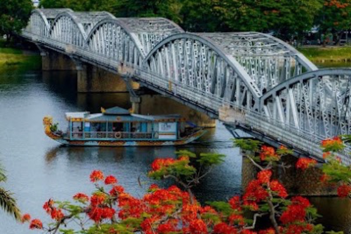 Trang Tien Bridge lit up over the Perfume River at night in Hue