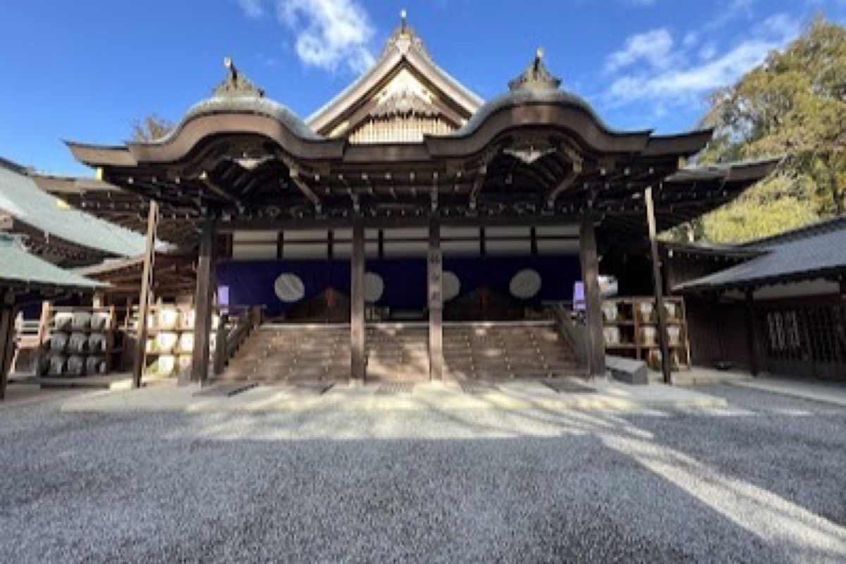 Cedar-lined gravel approach to Ise Jingu Naiku inner sanctuary along the Isuzu River