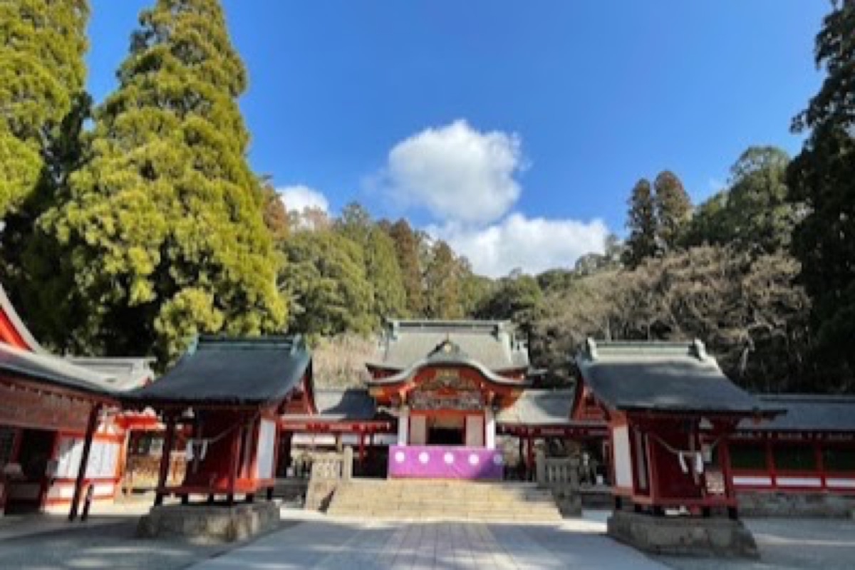 Kirishima Grand Shrine vermilion torii gate surrounded by cedar forest and mountain mist