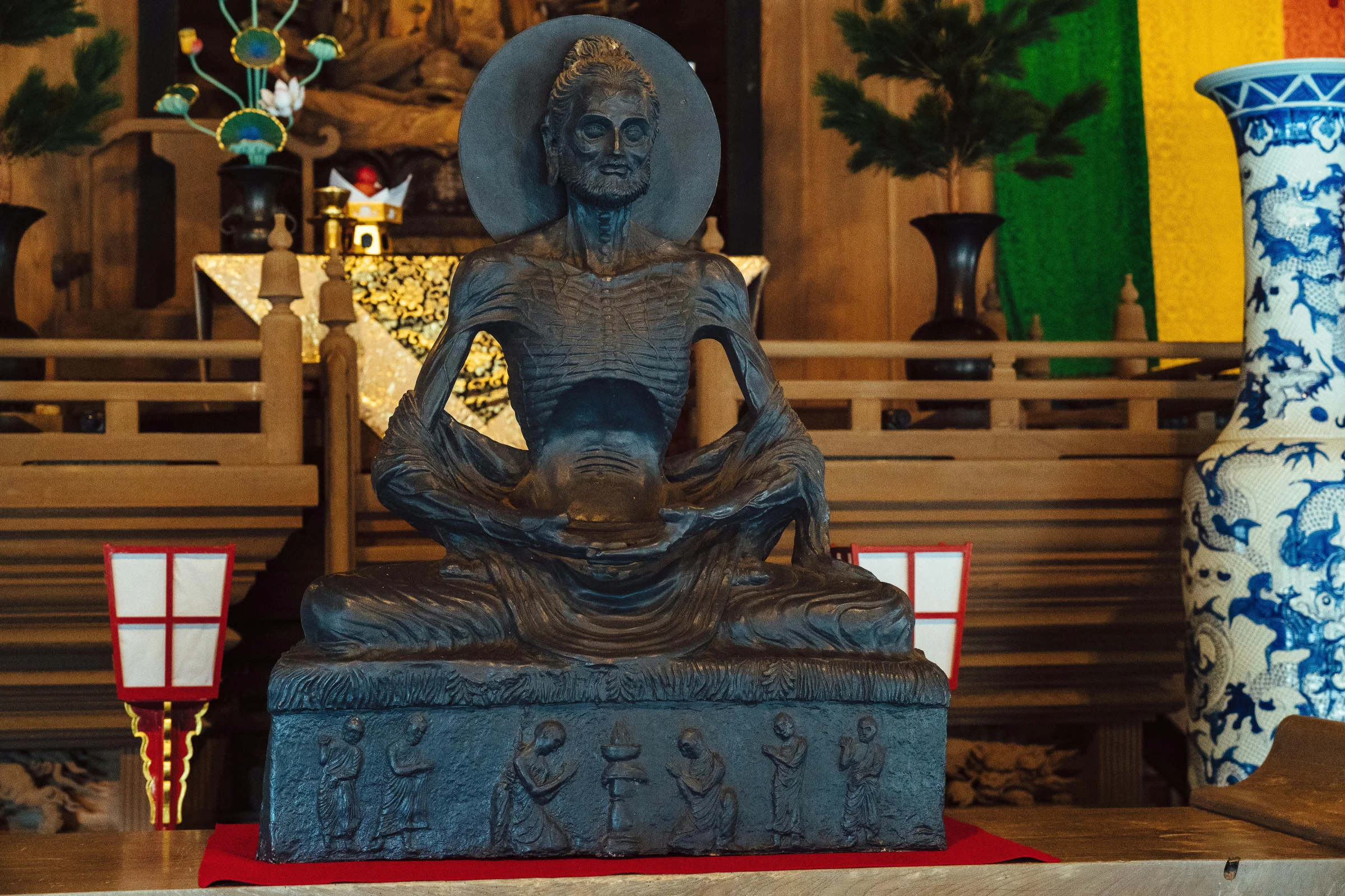 Hero image of Kamakura showing a traditional temple street leading toward the ocean in Japan.