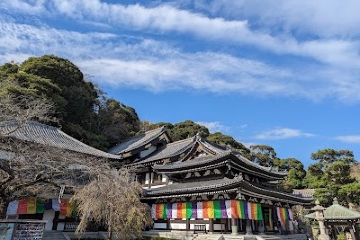 Hasedera Temple hillside overlooking Yuigahama Bay with Jizo statues along the path