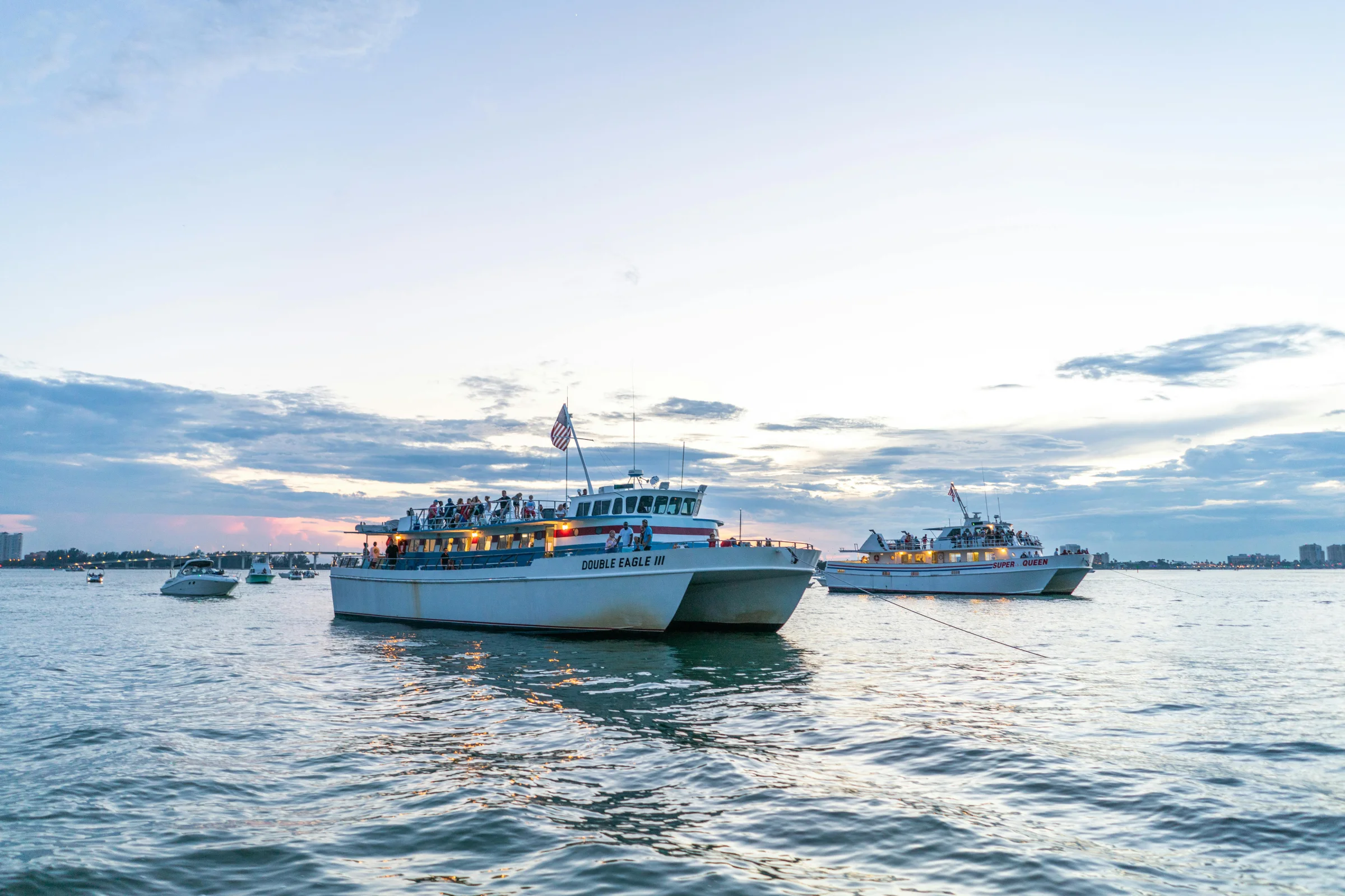 Sunset over a Key Largo marina with palm trees and calm ocean water