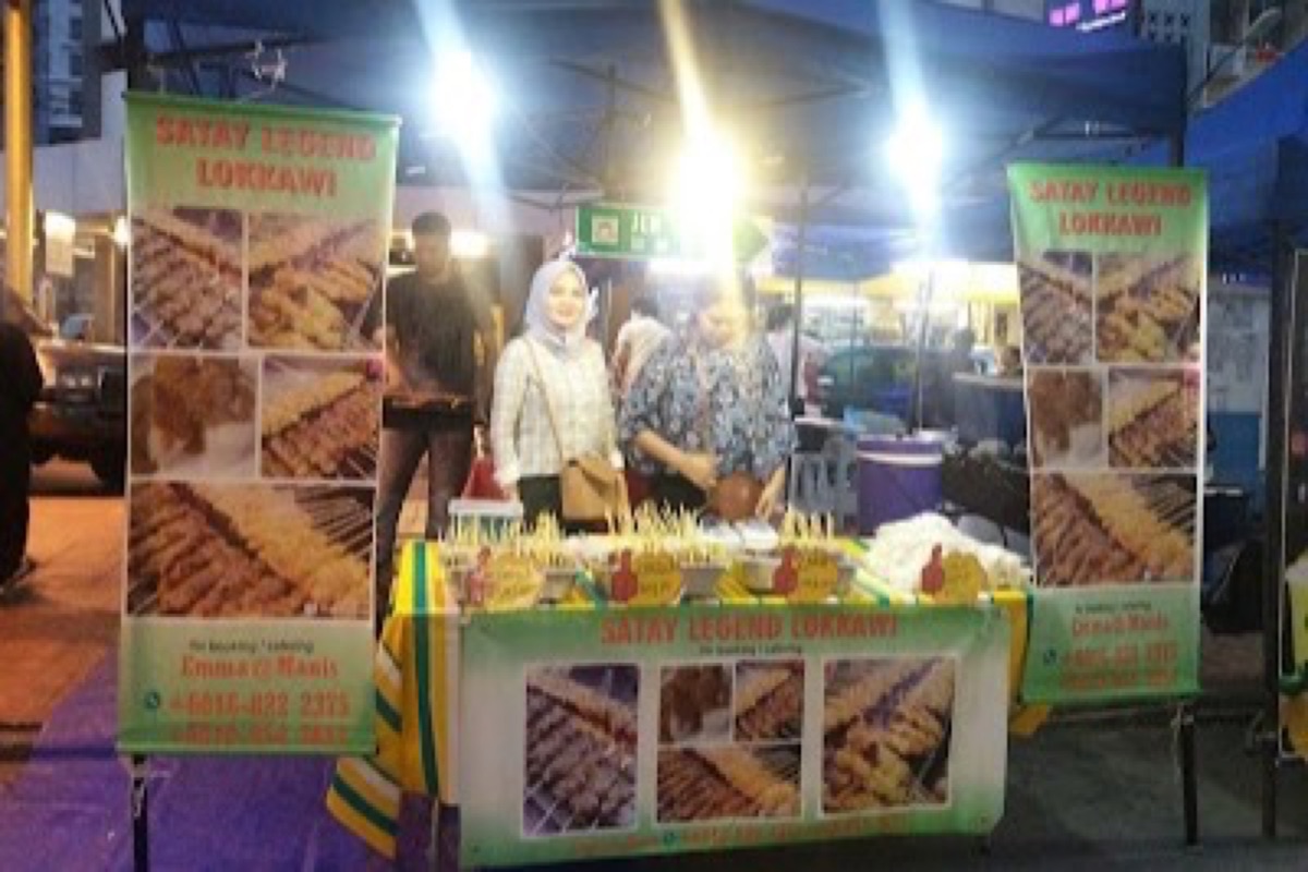 Gaya Street Sunday Market stalls of Sabah coffee and crafts along heritage shopfronts in Kota Kinabalu