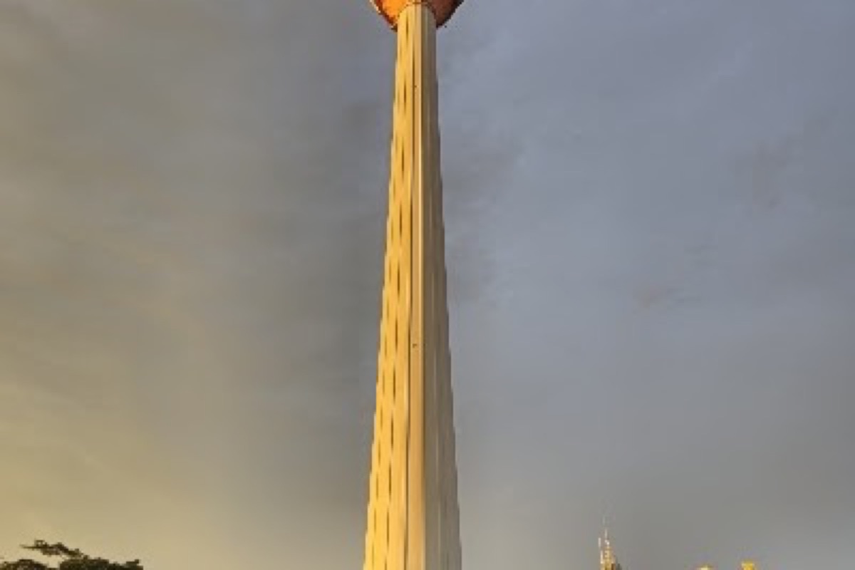 KL Tower open-air observation deck overlooking the Kuala Lumpur skyline at sunset
