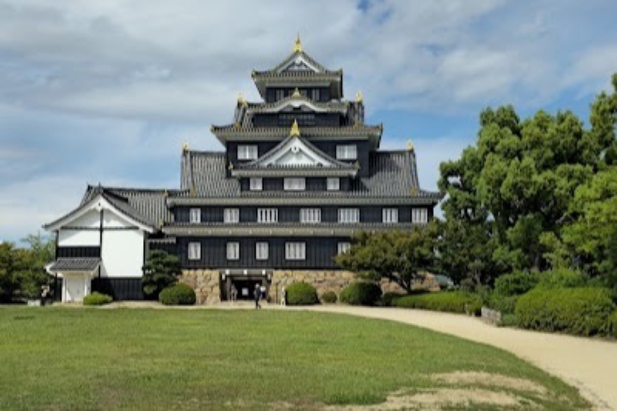 Okayama Castle black-walled Crow Castle keep reflected in the Asahi River