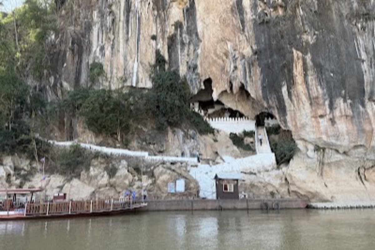 Buddha statues lining the mouth of the Pak Ou Caves above the Mekong River
