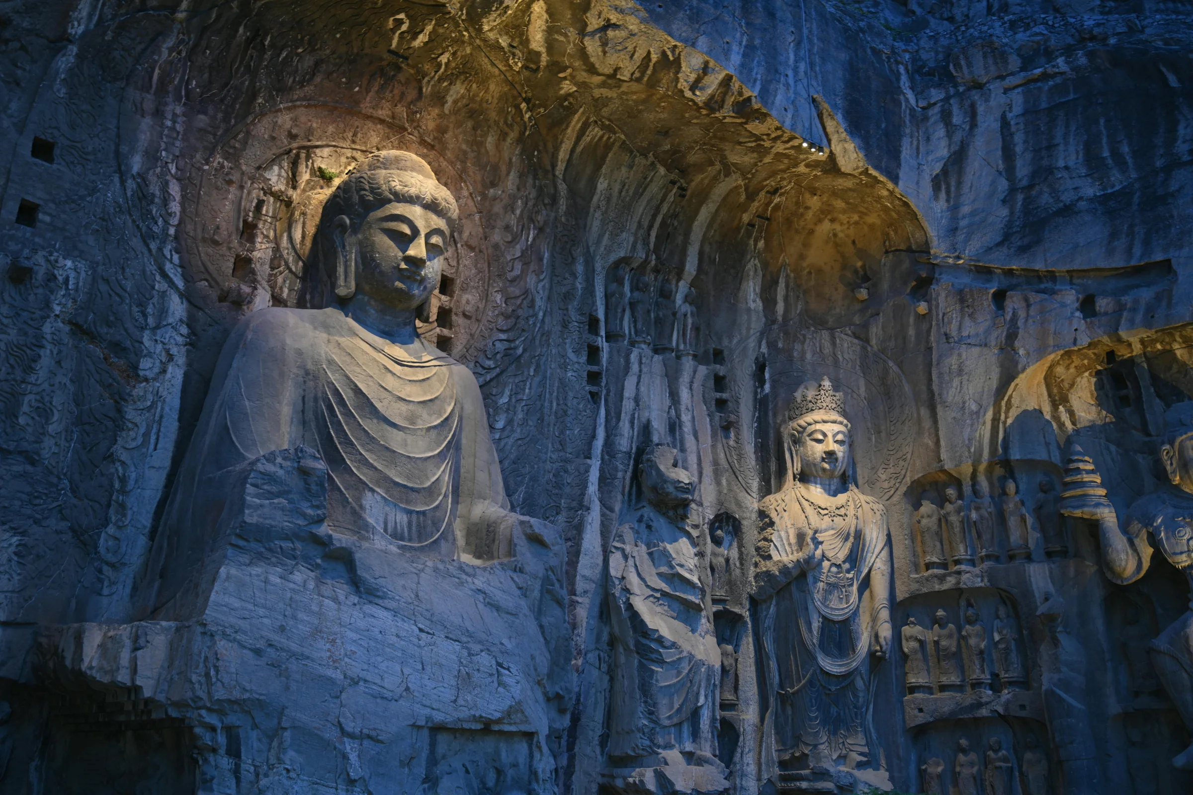 Cliffside view of the Longmen Grottoes Buddha statues in Luoyang, Henan, China.