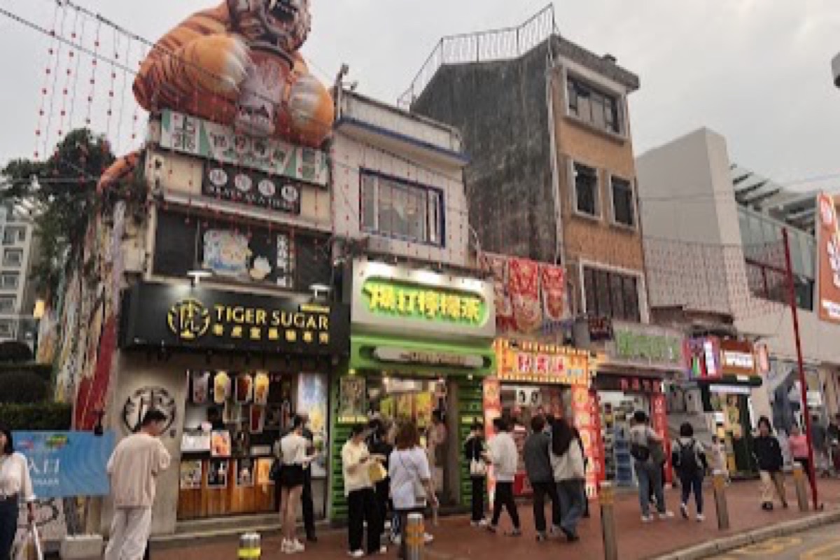 Rua do Cunha pedestrian food street with almond cookie and jerky shops in Taipa Village Macau