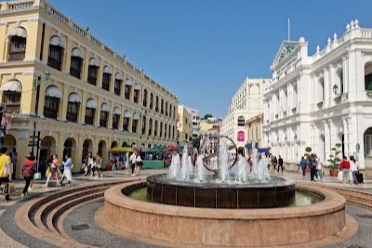 Senado Square wave-patterned pavement and pastel colonial facades in Macau's Historic Centre