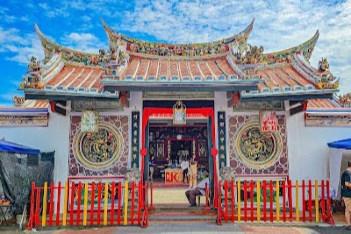 Intricately carved roof detail and incense at Cheng Hoon Teng Temple in Malacca