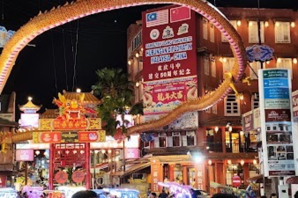 Jonker Street night market stalls glowing along Jalan Hang Jebat in Malacca after dark