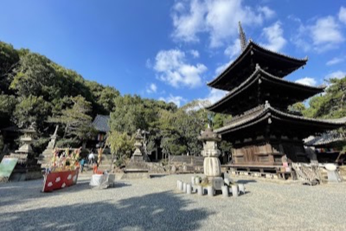 Ishite-ji Temple entrance with stone path and traditional gate in Matsuyama