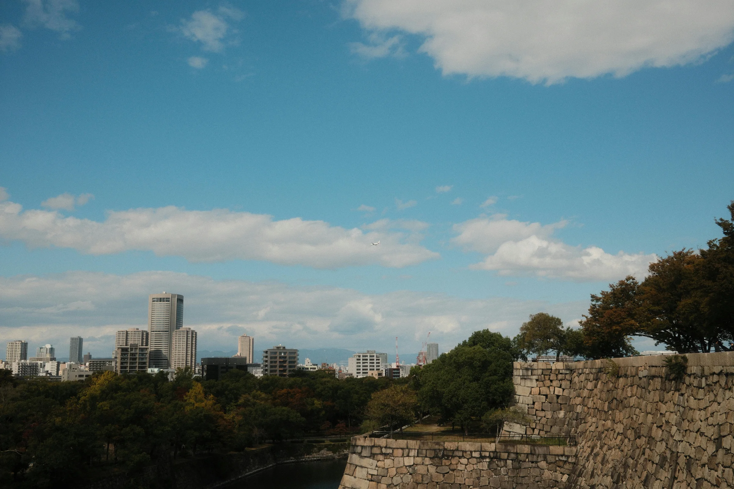 Panoramic Matsuyama cityscape in Japan featuring Matsuyama Castle on the hill above the skyline.