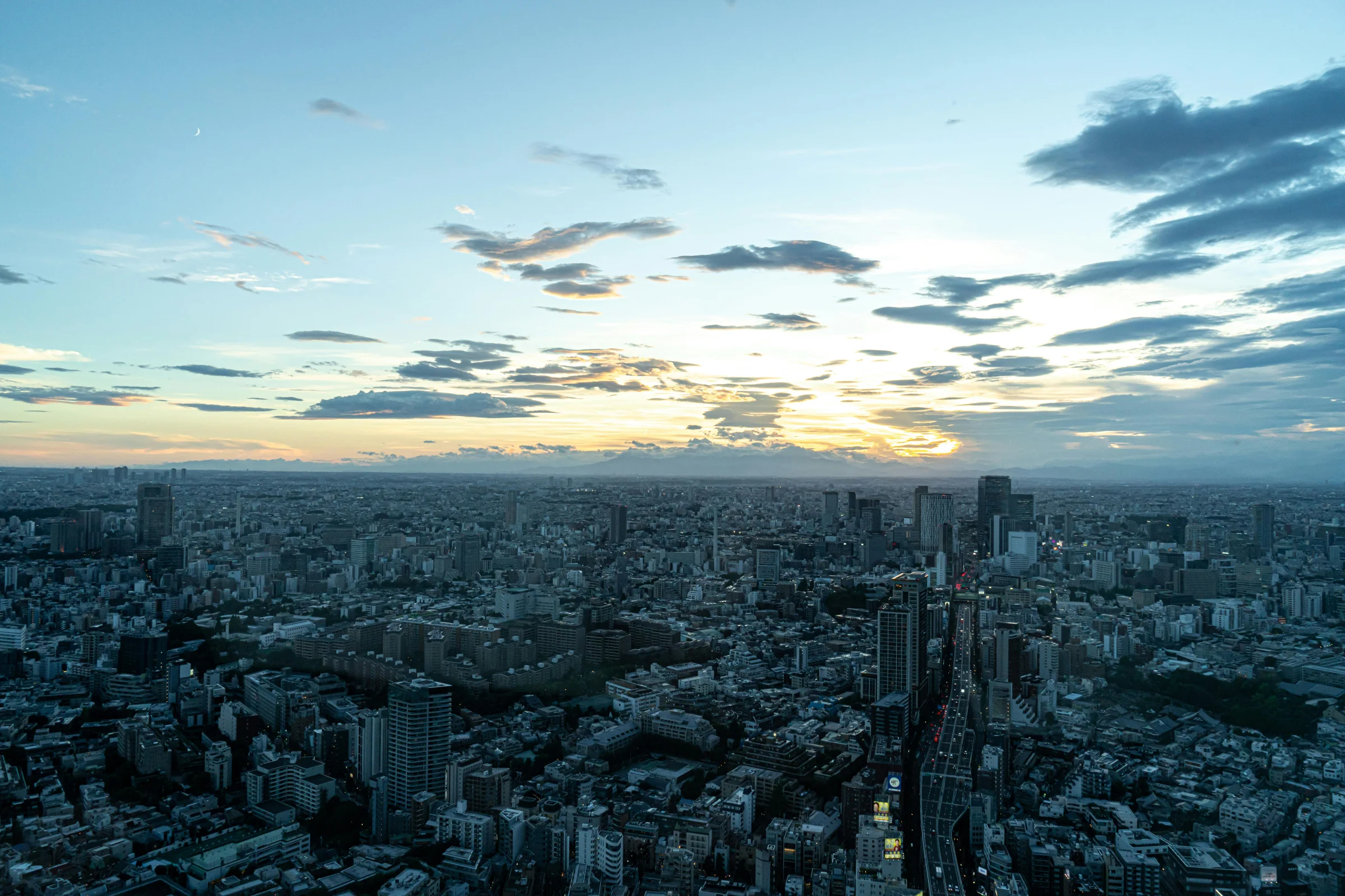 Aerial sunset view of Matsuyama Castle overlooking Matsuyama city, Ehime, Japan