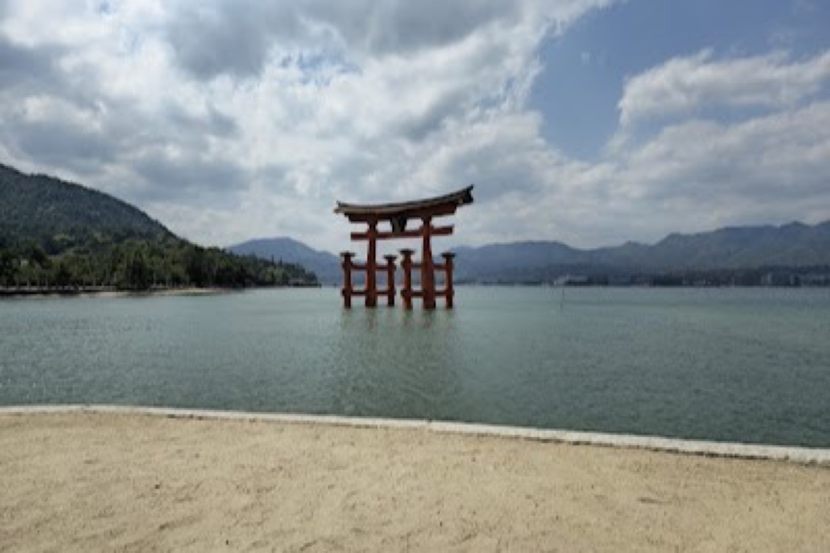 Itsukushima Shrine vermillion corridors floating above the bay at high tide
