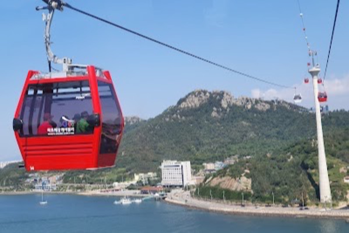 Mokpo Marine Cable Car cabin soaring over turquoise coastal waters toward Gohado Island
