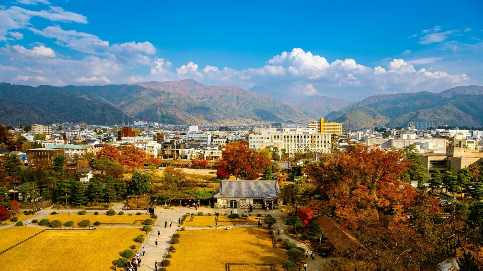 Zenko-ji Temple main hall and pagoda rising above Nagano's temple district at dusk