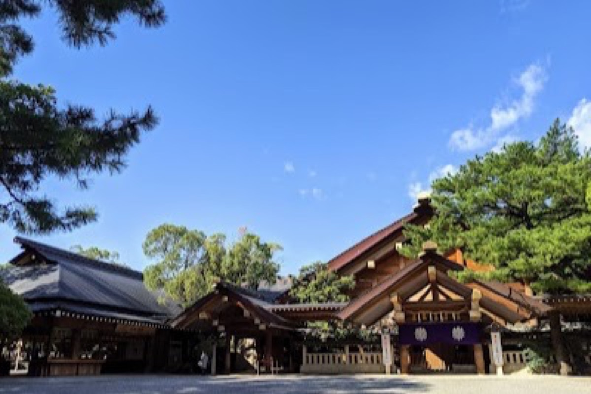 Atsuta Jingu shrine pathway lined with trees and stone lanterns in Nagoya